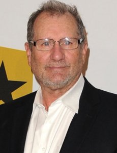 Ed O’Neill posing for a photo with glasses
