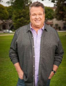 Eric Stonestreet body photo smiling with a casual outfit