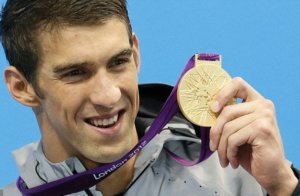 Michael Phelps with one of his gold medals