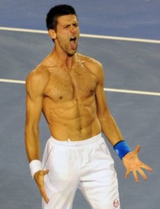 Shirtless image of Novak Djokovic showing his abs where it's possible to check his weight