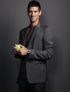 Novak Djokovic looking handsome in a grey suit and shirt