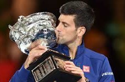 Novak Djokovic kissing a trophy
