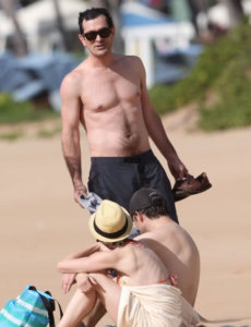 Ty Burrell body shirtless in a beach with sunglasses showing his fit body